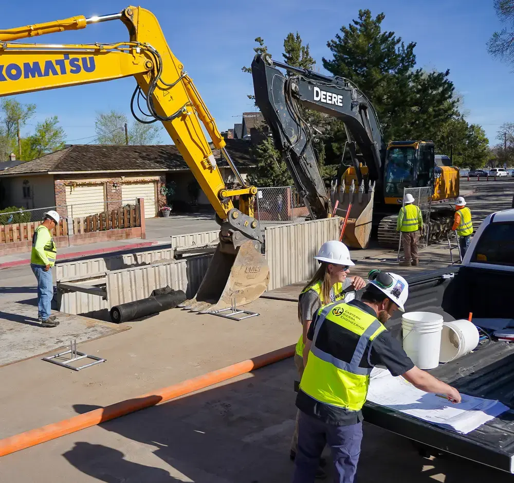 ESE team members reviewing plans together on a construction site